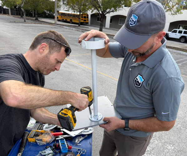 TXP Security technicians assembling commercial camera