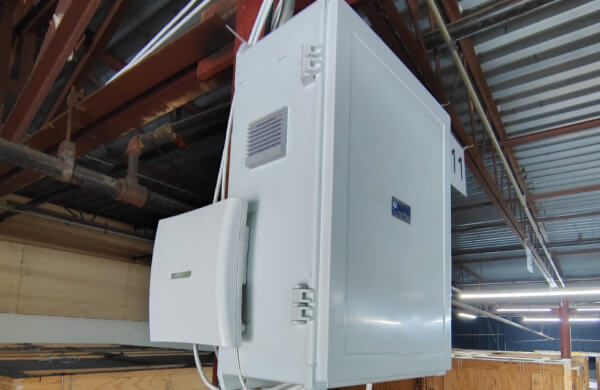 Commercial alarm panel and keypad installed in a warehouse