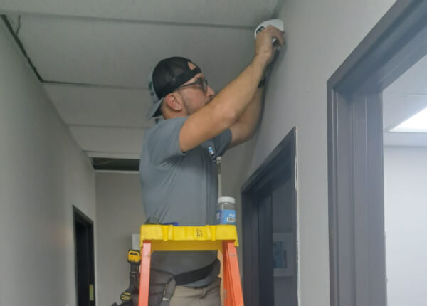Commercial security camera installation inside a Tyler office hallway