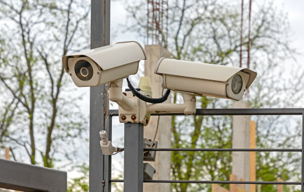 Commercial security cameras monitored live on an Austin property
