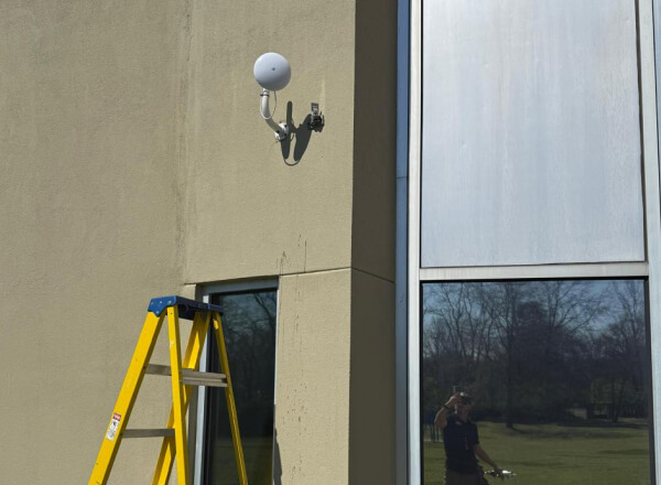 Video surveillance system camera mounted on Austin office building exterior