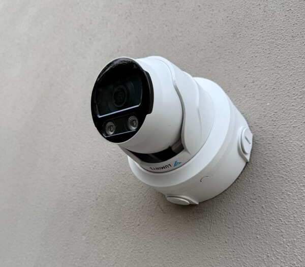 Commercial security camera installed on a San Marcos wall