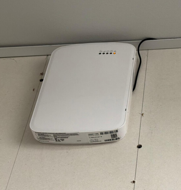 Wall-mounted cellular alarm communicator for dual-path alarm monitoring