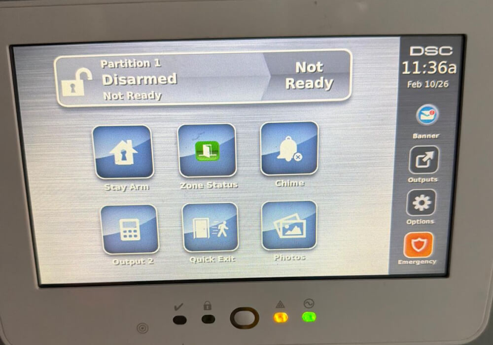Commercial alarm keypad showing system status and indicator lights