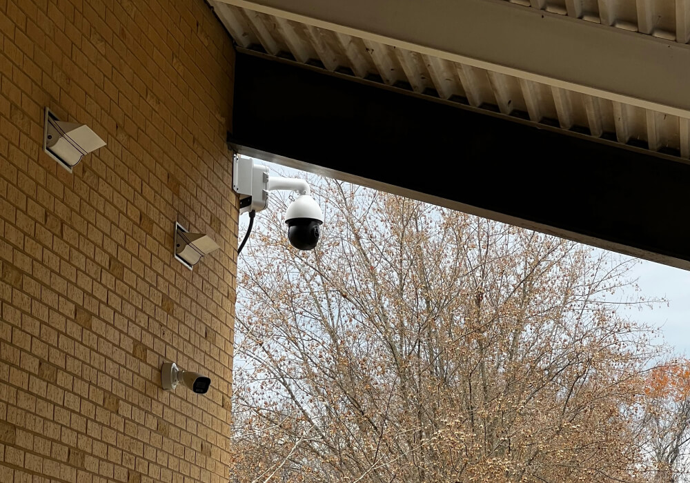 Security cameras installed under the overhang of a synagogue building