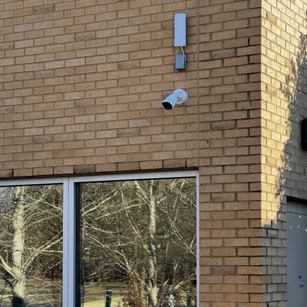 Security camera and antenna mounted on a synagogue exterior wall