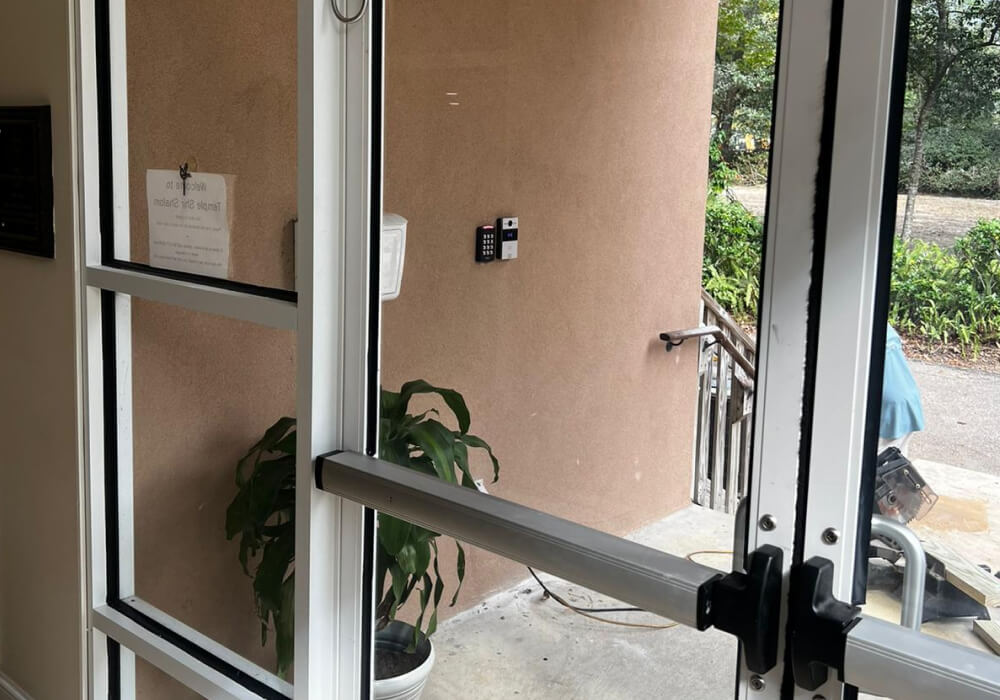 Video intercom and keypad beside a synagogue front door entrance